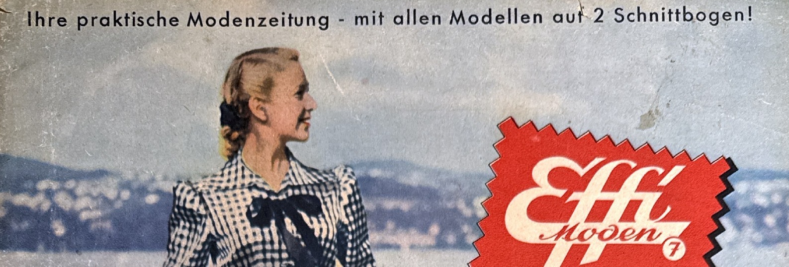 Detail of Effi moden Nr. 7 pinked red fabric swatch logo and top banner